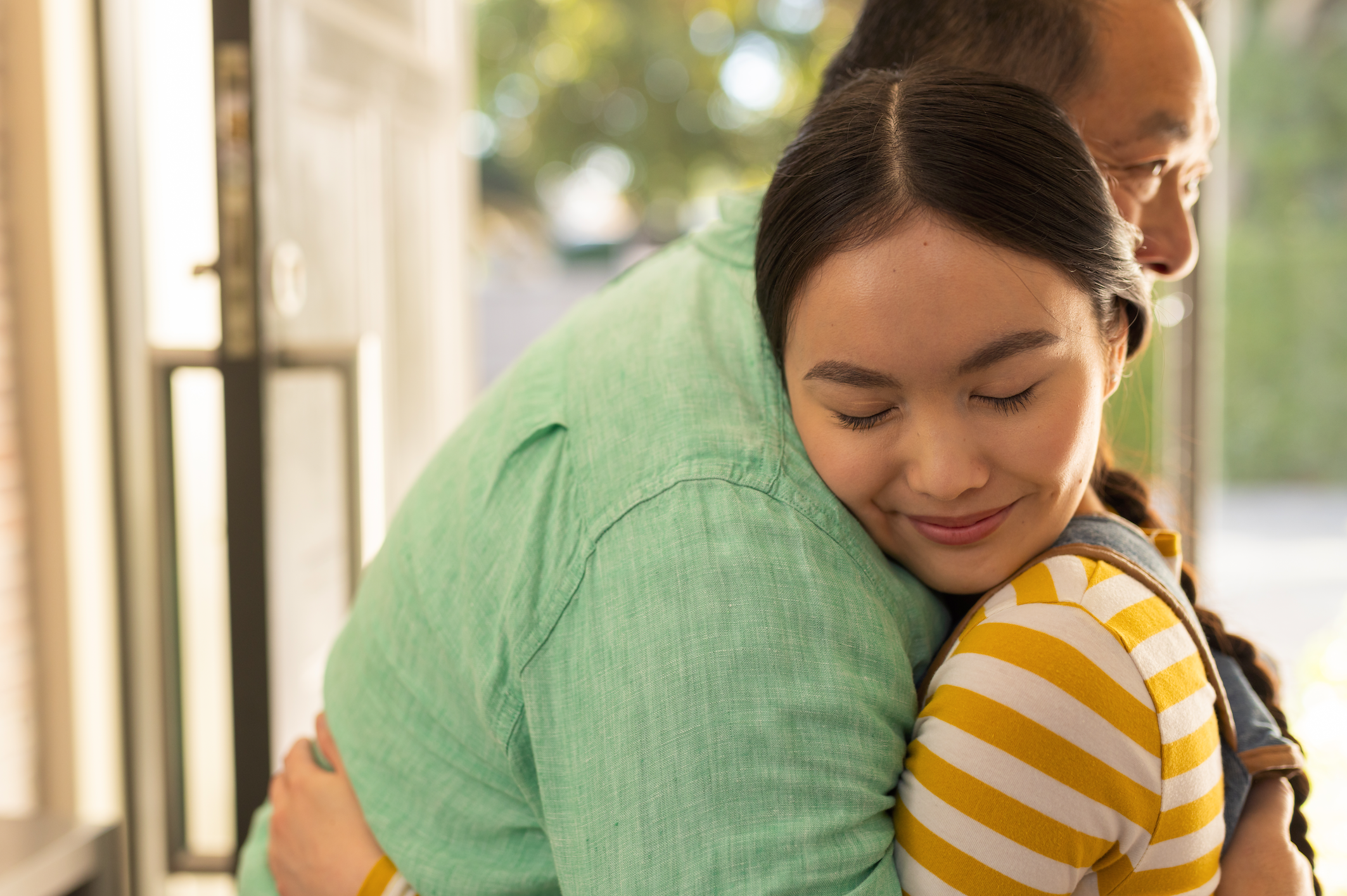 father and daughter hugging